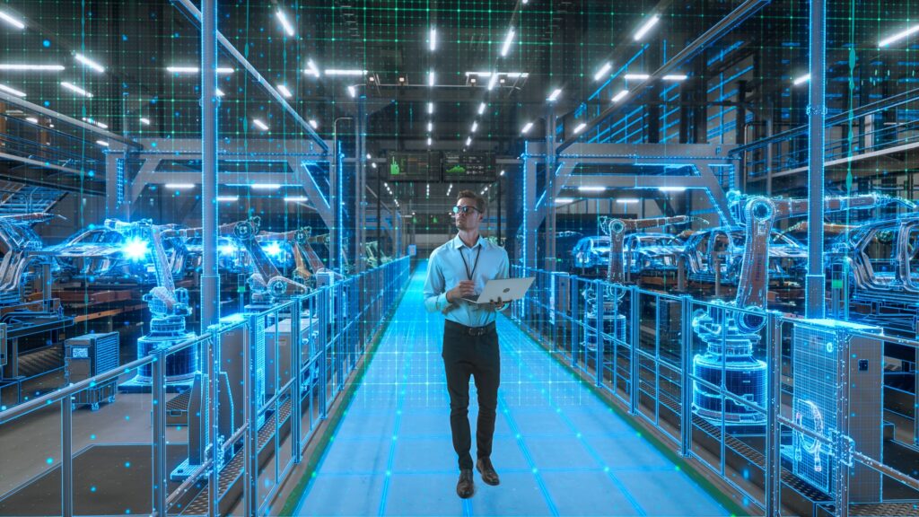 Cyfrowy bliźniak linii produkcyjnej wyświetlony na monitorze inżyniera automatyki - technologia smart factory w praktyce